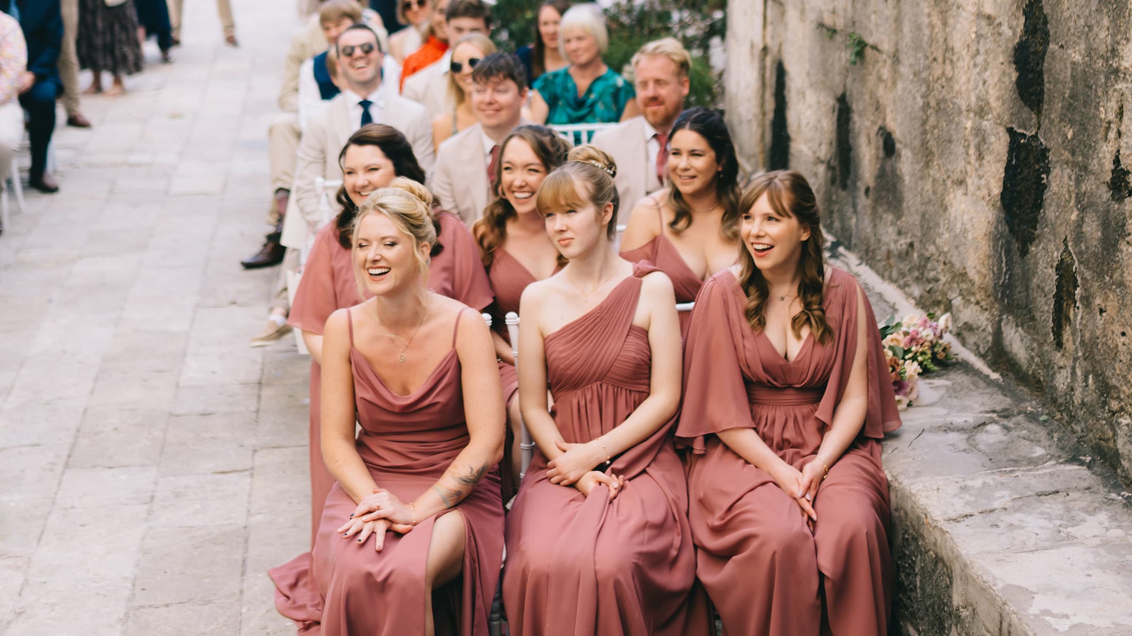 Wedding terrace in the old square, with chairs and floral arrangements.